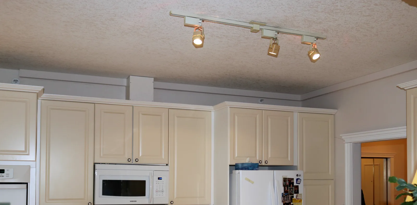 Plumbing Track route installed above cabinets in an occupied home