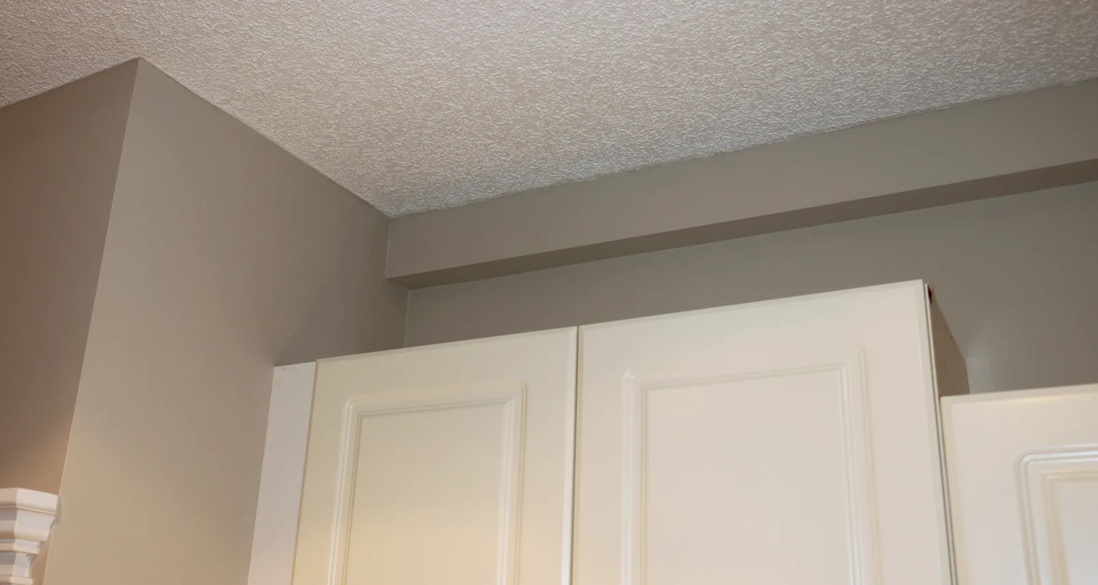 Plumbing Track work coordinated above existing kitchen cabinets