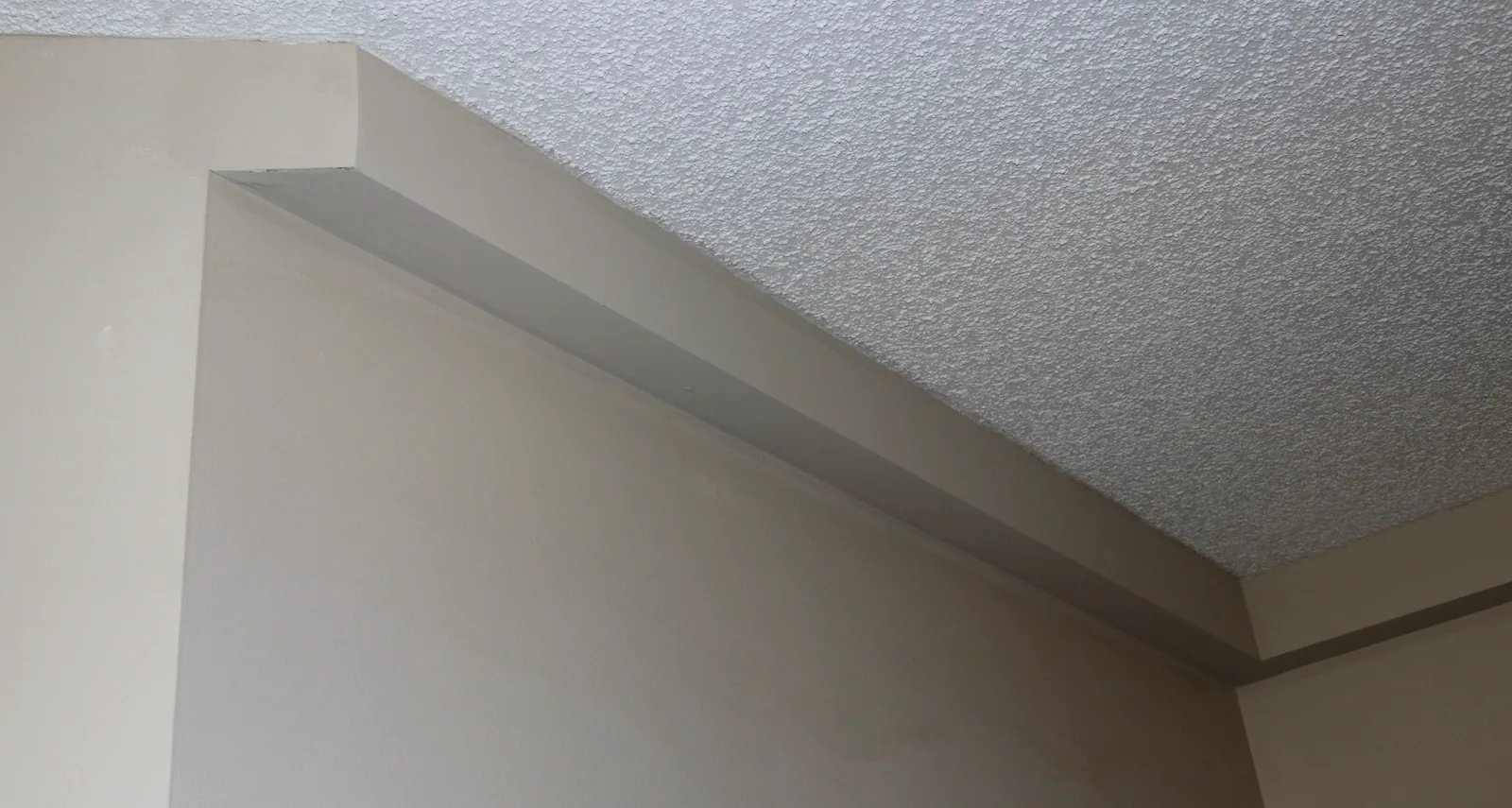 Painted finished Plumbing Track detail at the wall and ceiling