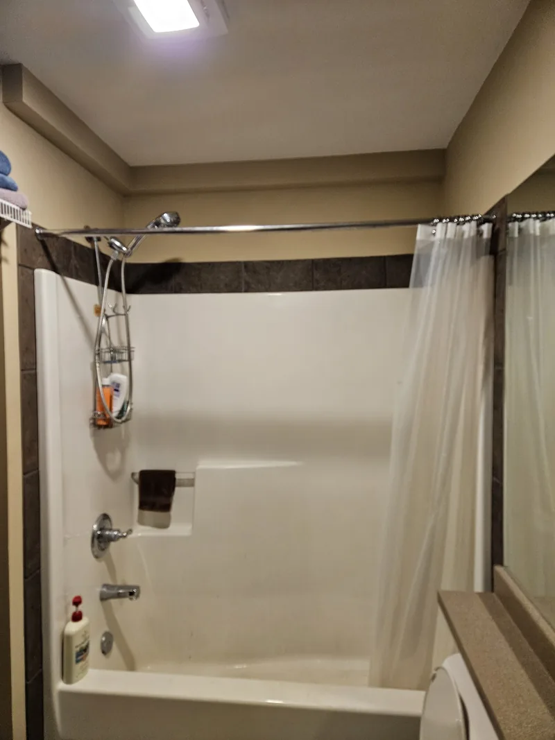 Finished Plumbing Track enclosure integrated with a room