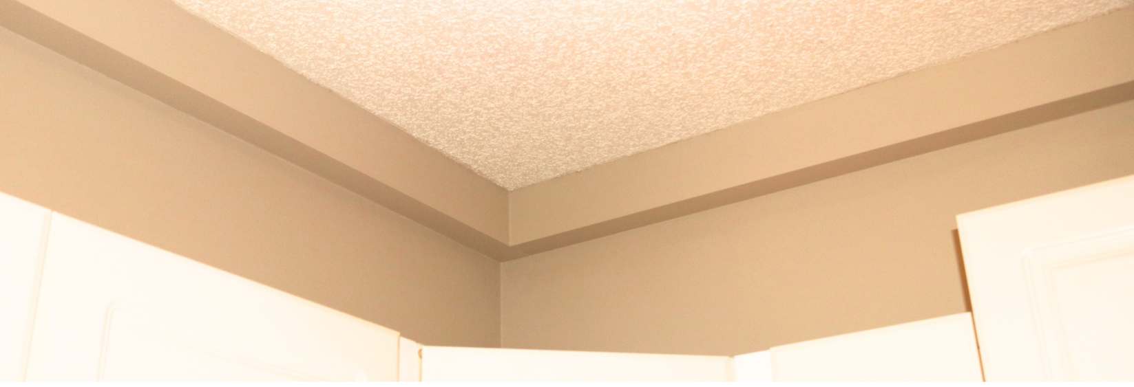 Plumbing Track installed and painted in a finished corridor